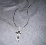 Silver cross with leather like new