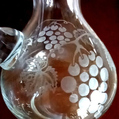 Handmade oil and vinegar set with carved glass bottles and wooden base