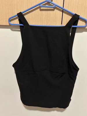 Black top new with side zipper and bow details, fits L to XL