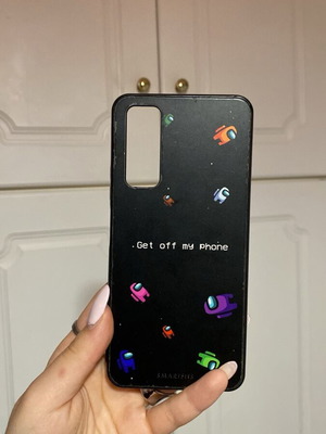 Black phone case used with Among Us design
