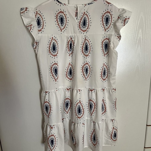 Dress with eye motifs and ruffles on sleeves and hem one size new