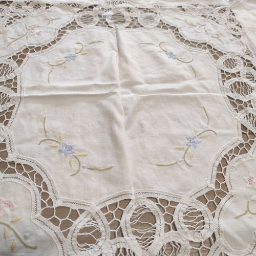 Small tablecloth used, white with lace and flowers