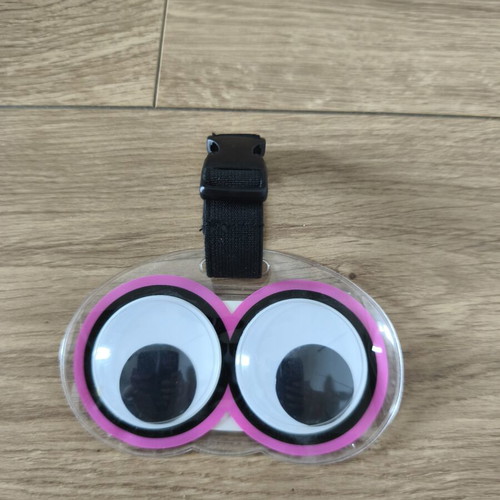 Luggage tag with moving eyes, new