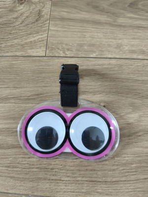 Luggage tag with moving eyes, new