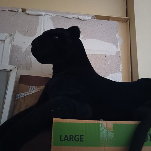 Large plush black panther with blue eyes, like new