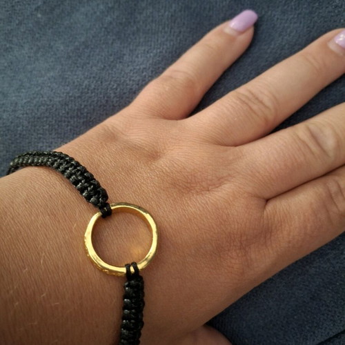 Bracelet like new in black color with gold details