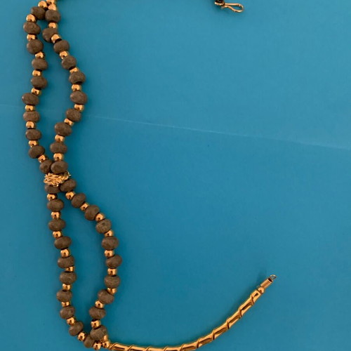 Necklace with khaki stone and gold used