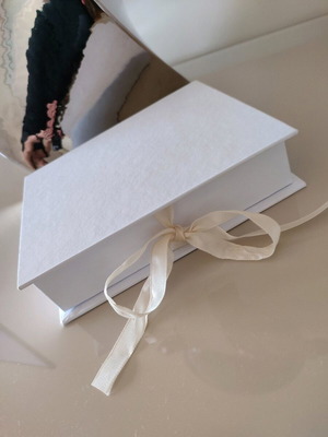 White paper storage box with beige ribbon in excellent condition