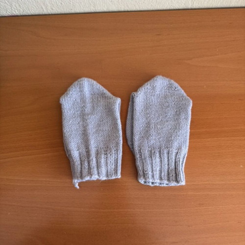 Handmade woolen socks in soft light blue color, new