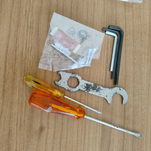 Various tools set used with 2 screwdrivers, 4 allen keys, screws and nails