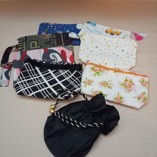 Set of 7 toiletry bags and 1 black satin pouch new, multicolored
