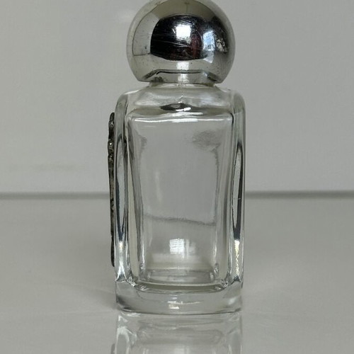 Vintage glass perfume bottle with metal tulip decoration