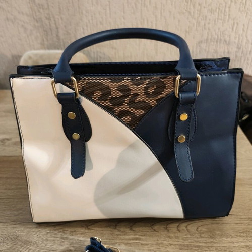 Color-block blue/white handbag used with animal print and detachable strap