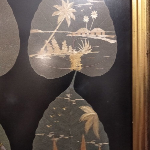 Painting with African figures hand-painted on dried leaves with gold frame and glass