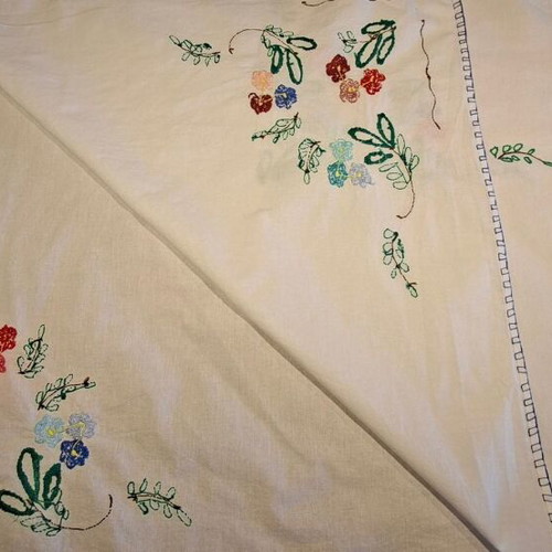 Vintage handmade embroidered tablecloth with flowers and needlework