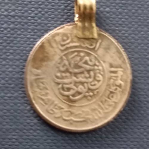 Pendant amulet made from Afghanistan coin used