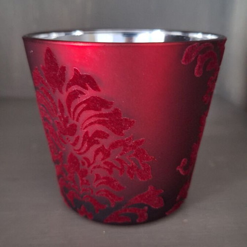 Glass candlestick like new with embossed velvet and silver glazing