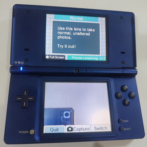 Nintendo DSi handheld console with Pokemon HeartGold game