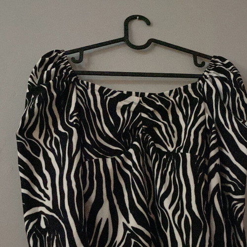 Zebra print blouse new, animal print with puffed shoulder, size S