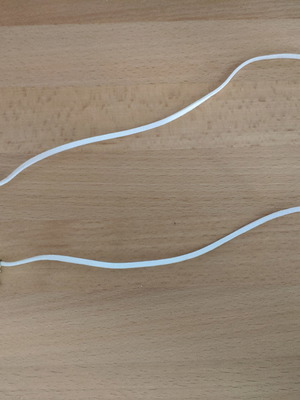 White necklace used with metal pendant and stones