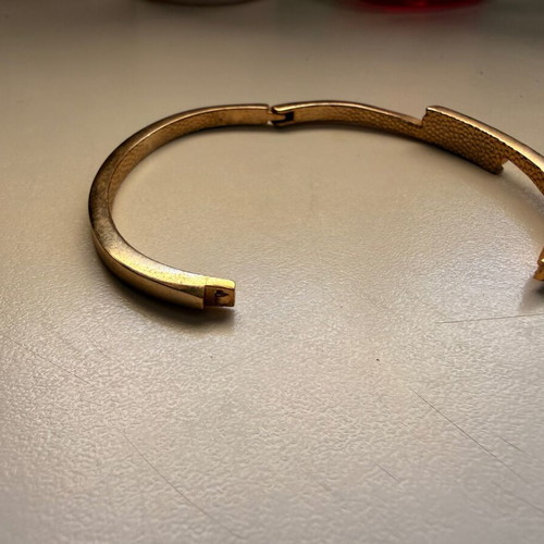 Gold-tone bracelet with white stones