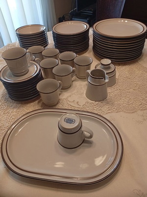 Noritake dinnerware set like new, 47 pieces, ecru with brown border