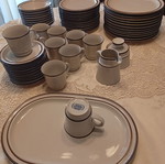 Noritake dinnerware set like new, 47 pieces, ecru with brown border