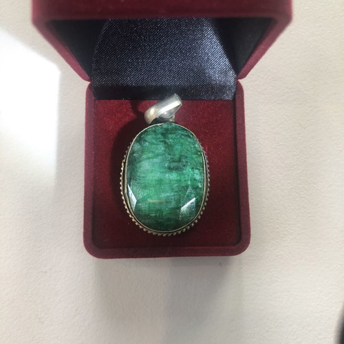 Necklace of smelted emerald like new with black ribbon