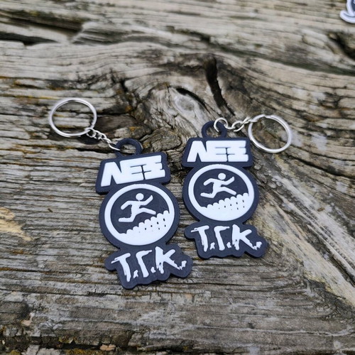 Set of 2 Lex T.G.K. keychains new with embossed design