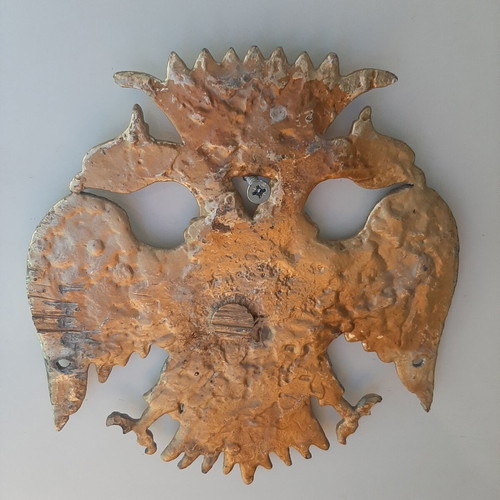 Metallic double-headed eagle coat of arms like new from old church