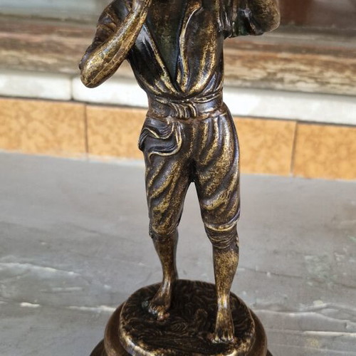 Vintage bronze sculpture of a boy playing flute used
