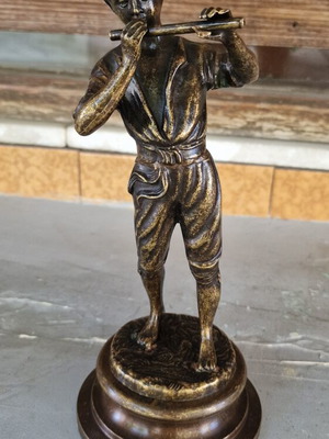 Vintage bronze sculpture of a boy playing flute used