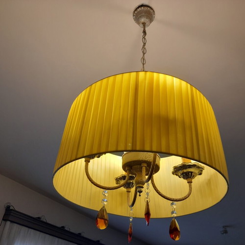 Ceiling light with brass parts and yellow lampshade
