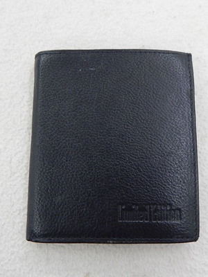 Leather wallet, unused, with compartments for bills, coins, cards, and documents
