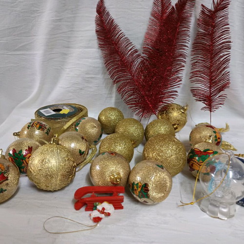 Christmas decorations like new, assorted ornaments and ribbon