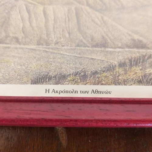 Frames with old photographic views of the Acropolis and the Palaces like new