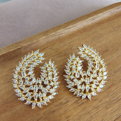 Gold earrings with zircon stones