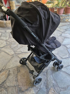 Maxi Cosi travel stroller used with accessories