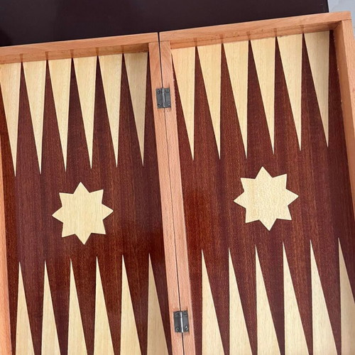 Wooden backgammon set used with colorful checkers and dice