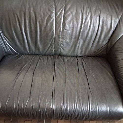 Black two-seater leather sofa used, soft genuine leather