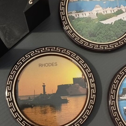 Vintage coaster set of 5 with original black holder from Rhodes