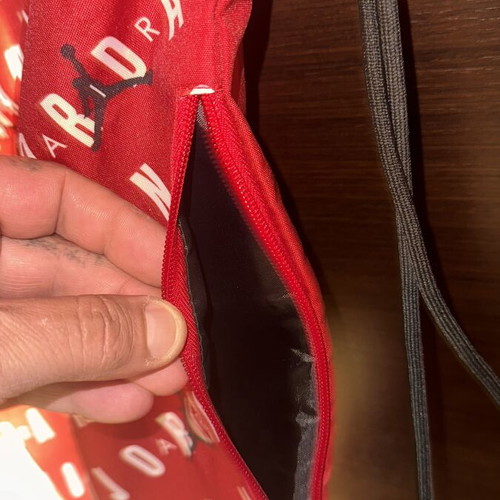 Jordan gym bag like new, red backpack
