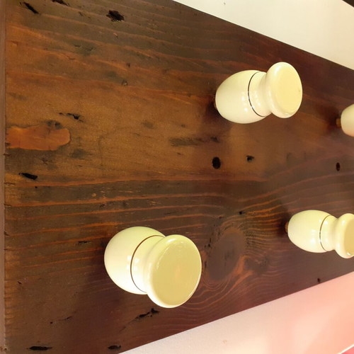Wooden wall hanger with handles from old barber shaving brushes