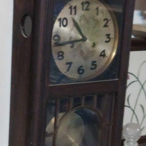 Wall clock pendulum used, wooden, old, with door and winding key