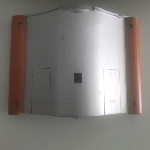 Retro digital tabletop clock with day, month, and year display