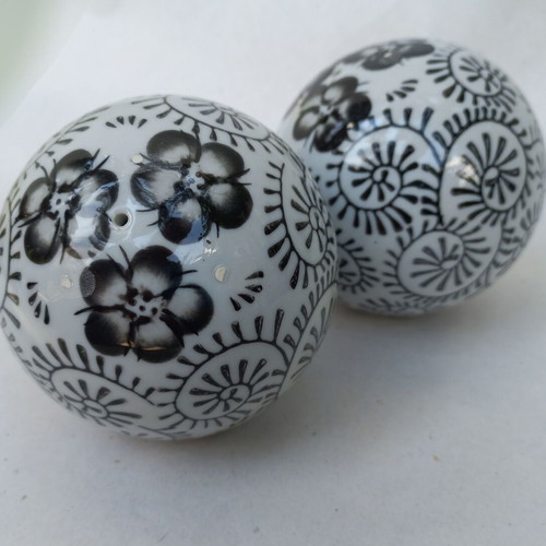 Vintage decorative porcelain spheres set like new with floral and geometric designs