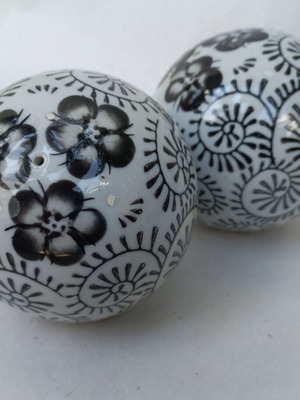 Vintage decorative porcelain spheres set like new with floral and geometric designs