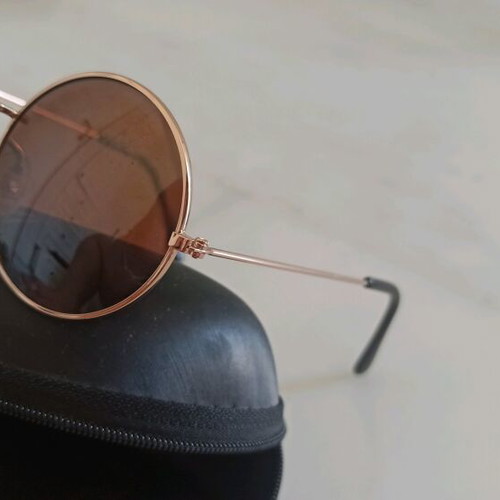 Round sunglasses used, metal frame, gold tone with brown lens