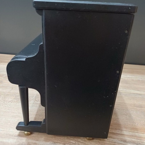 Piano music box used with compartments for small jewelry plastic