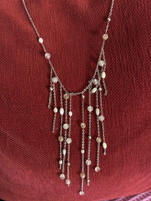 Silver pendant with asymmetrical details like new